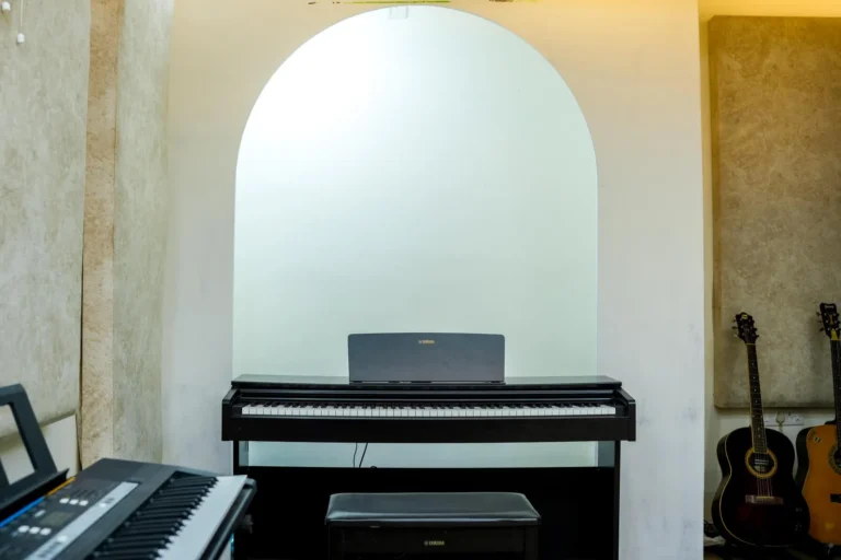 Piano room with an arched alcove