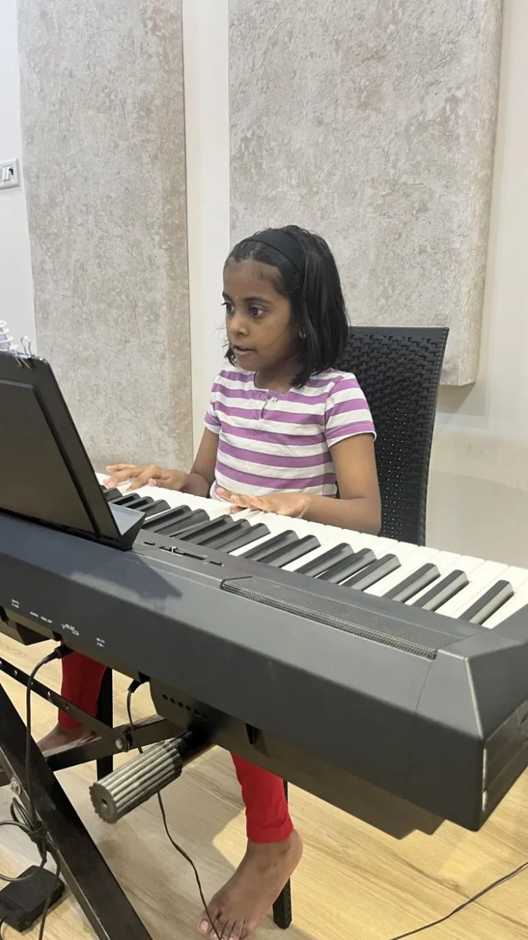 A girl practising on a digital piano
