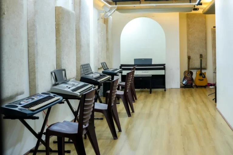 A practice room lined with keyboards