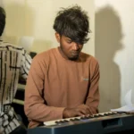 A student practising at the keyboard