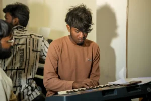 A student practising at the keyboard