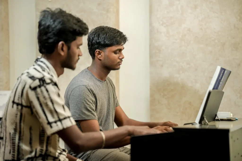 Two students at the digital piano