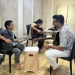 Two students in a strings lesson