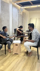 Two students in a strings lesson